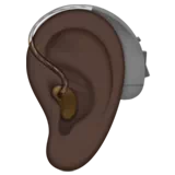 Ear with Hearing Aid: Dark Skin Tone — Apple