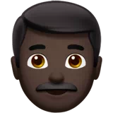 Man: Dark Skin Tone — Apple