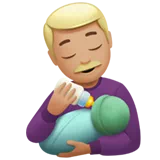 Man Feeding Baby: Medium-Light Skin Tone — Apple