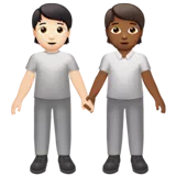 People Holding Hands: Light Skin Tone, Medium-Dark Skin Tone — Apple