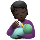 Person Feeding Baby: Dark Skin Tone — Apple