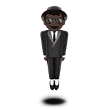 Person in Suit Levitating: Dark Skin Tone — Apple