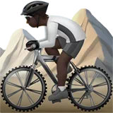 Person Mountain Biking: Dark Skin Tone — Apple