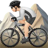 Person Mountain Biking: Light Skin Tone — Apple