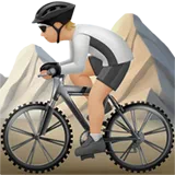 Person Mountain Biking: Medium-Light Skin Tone — Apple