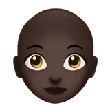 Woman: Dark Skin Tone, Bald — Apple