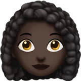 Woman: Dark Skin Tone, Curly Hair — Apple