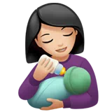 Woman Feeding Baby: Light Skin Tone — Apple