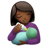 Woman Feeding Baby: Medium-Dark Skin Tone — Apple