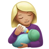 Woman Feeding Baby: Medium-Light Skin Tone — Apple