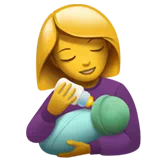 Woman Feeding Baby — Apple