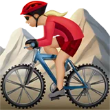Woman Mountain Biking: Medium-Light Skin Tone — Apple